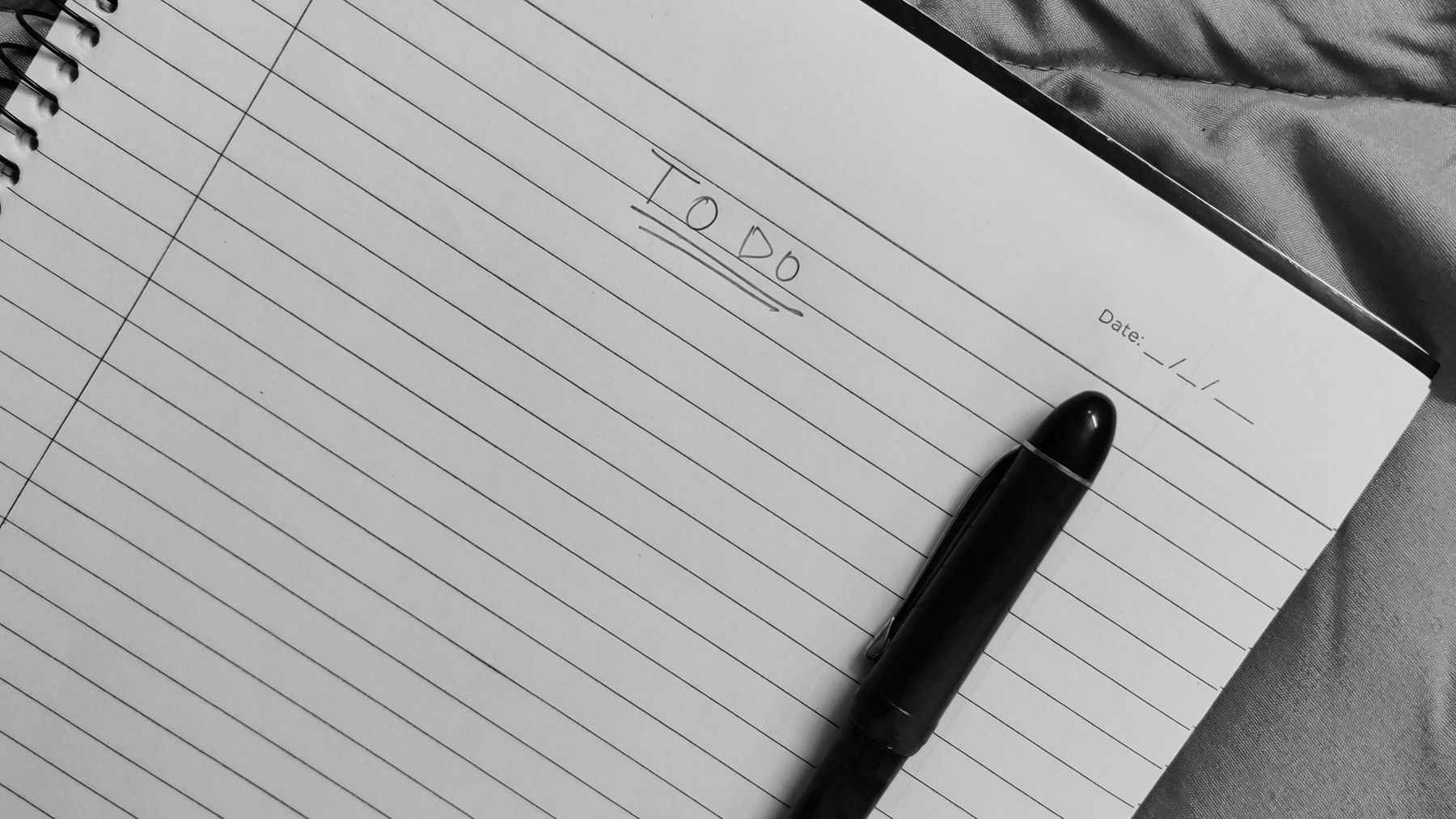 A planning notebook and pen